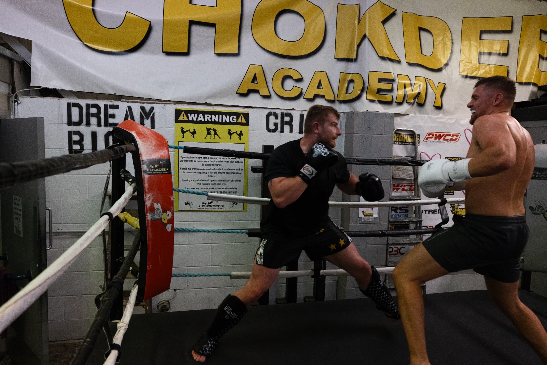 Coach pressuring forward during a ring sparring round