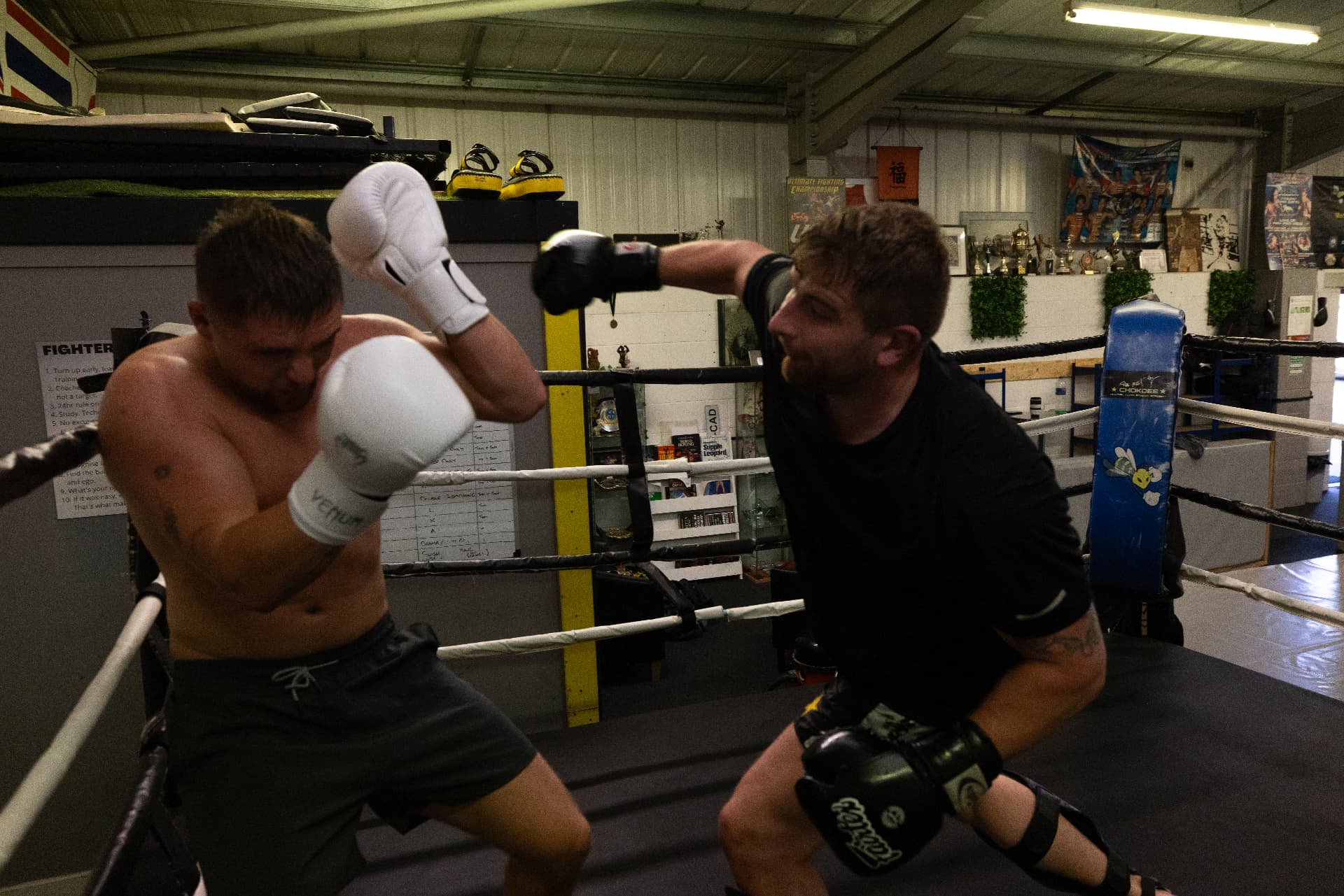Member throwing an overhand while his partner covers up