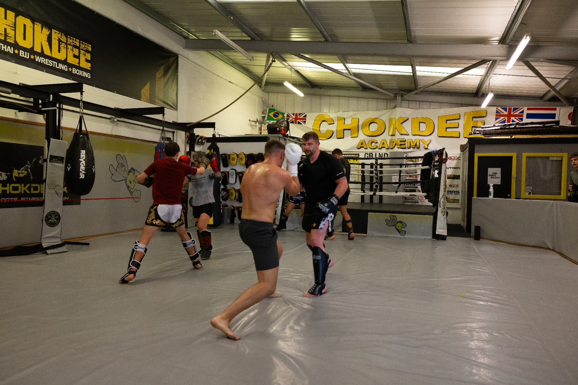 Wide view of the Chokdee Academy training floor and ring in York