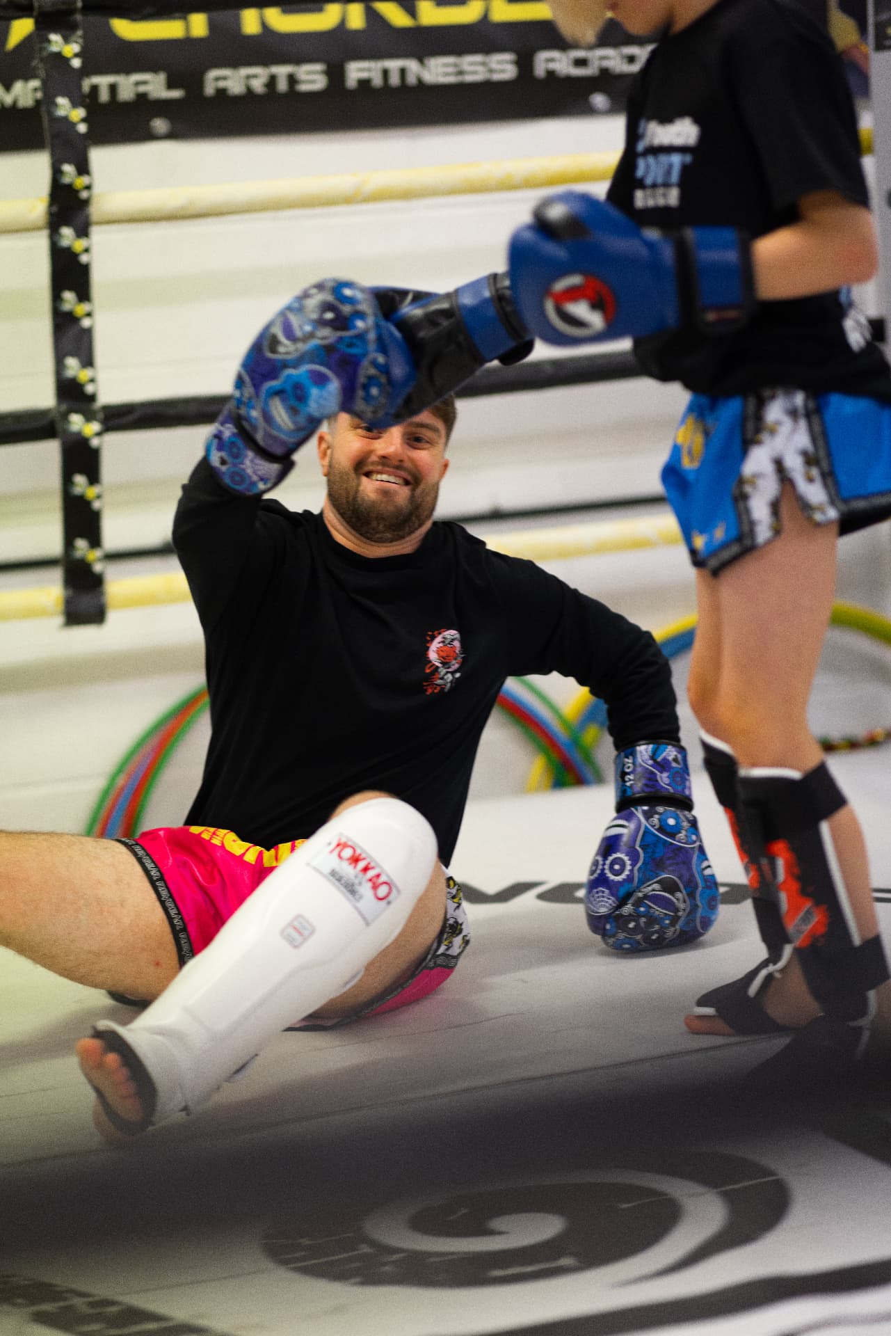 Coach and juniors sharing a laugh between rounds