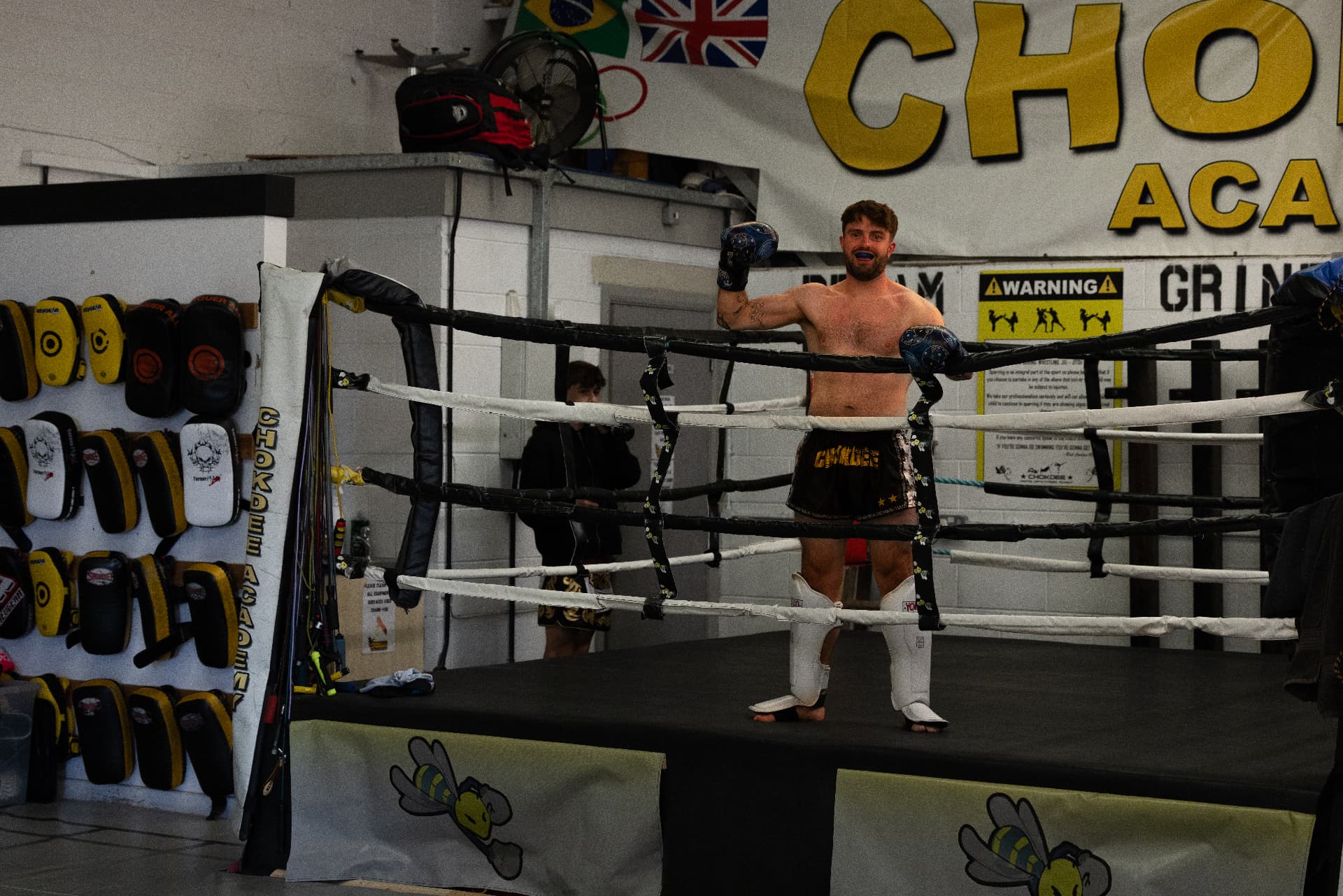 Chokdee fighter standing in the ring in academy shorts