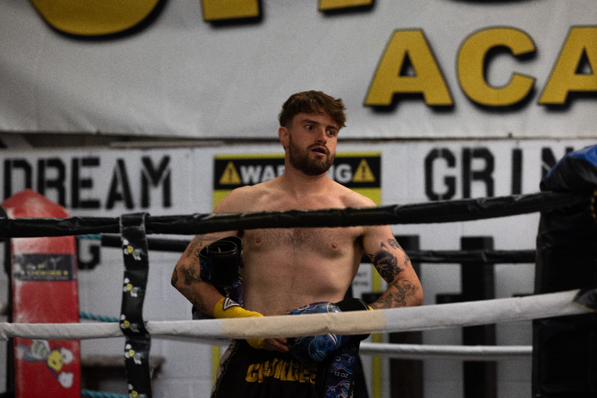 Chokdee fighter resting on the ropes during a sparring round